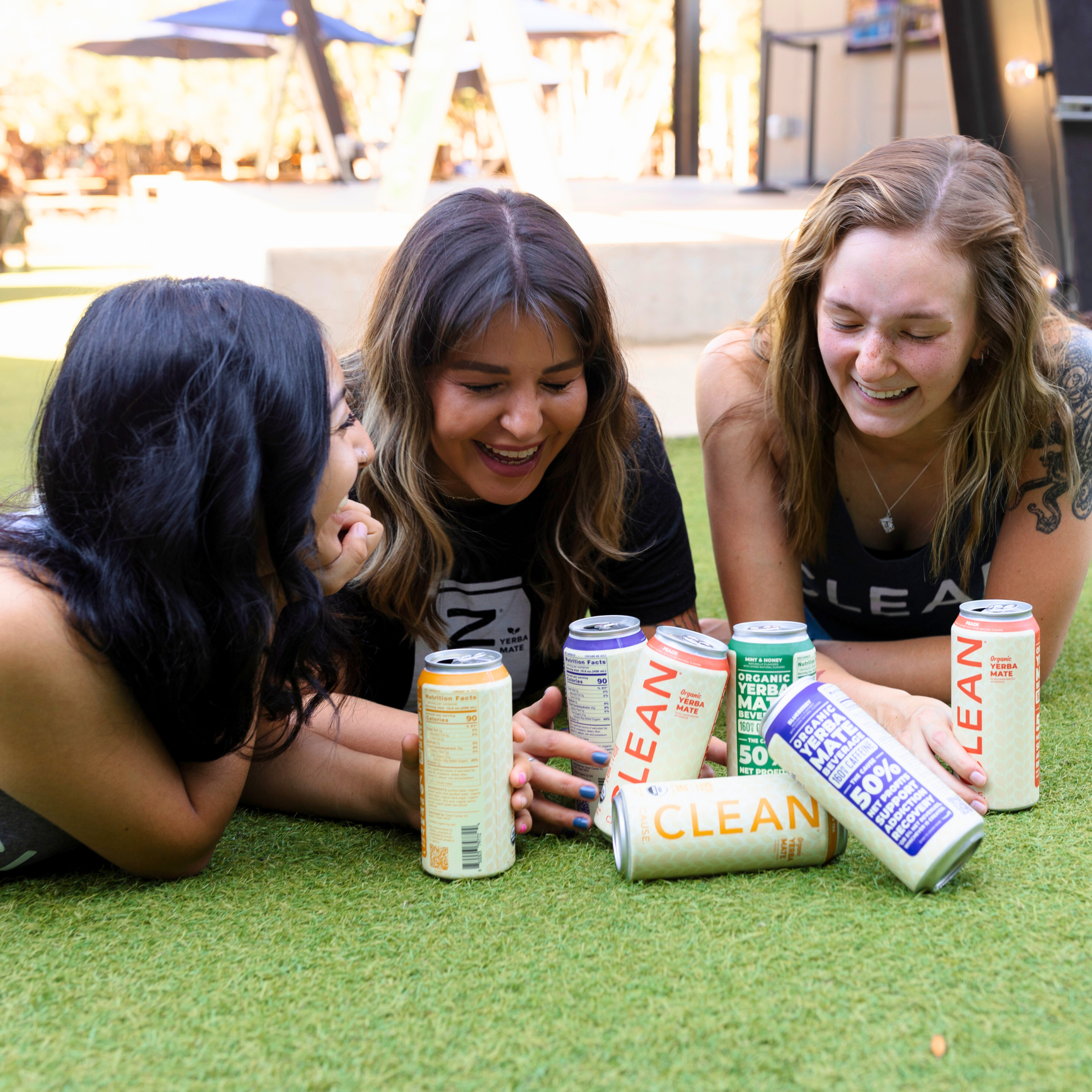 Friends laughing with CLEAN cans