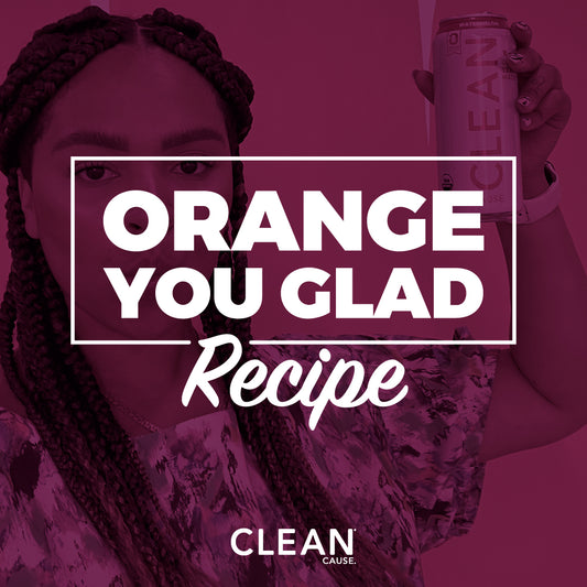Blurred background of kitchen with mocktails, text overlay reads "Orange you Glad 2020 is Over Mocktail".