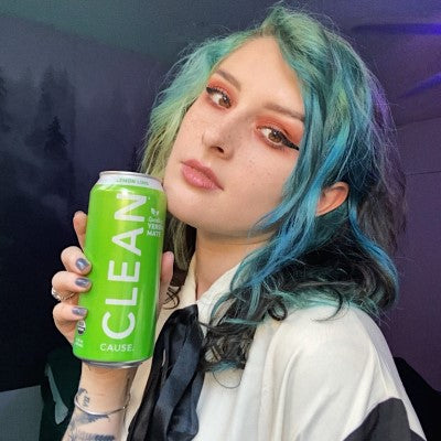 Mothica holding a can of CLEAN Lemon Lime