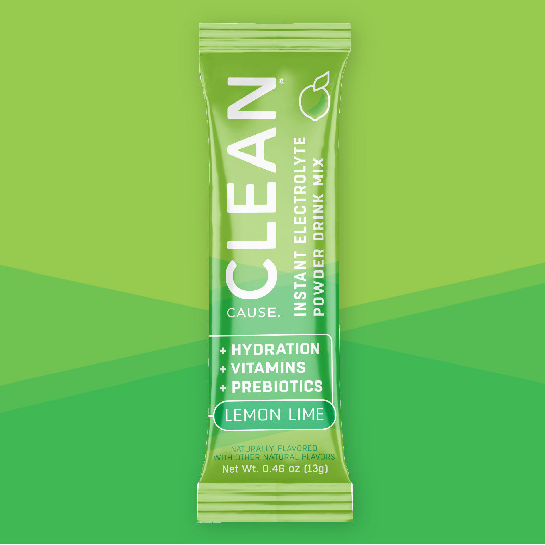 One CLEAN lemon lime instant electrolyte drink mix packet on a green background.