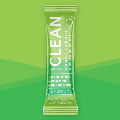 One CLEAN lemon lime instant electrolyte drink mix packet on a green background.